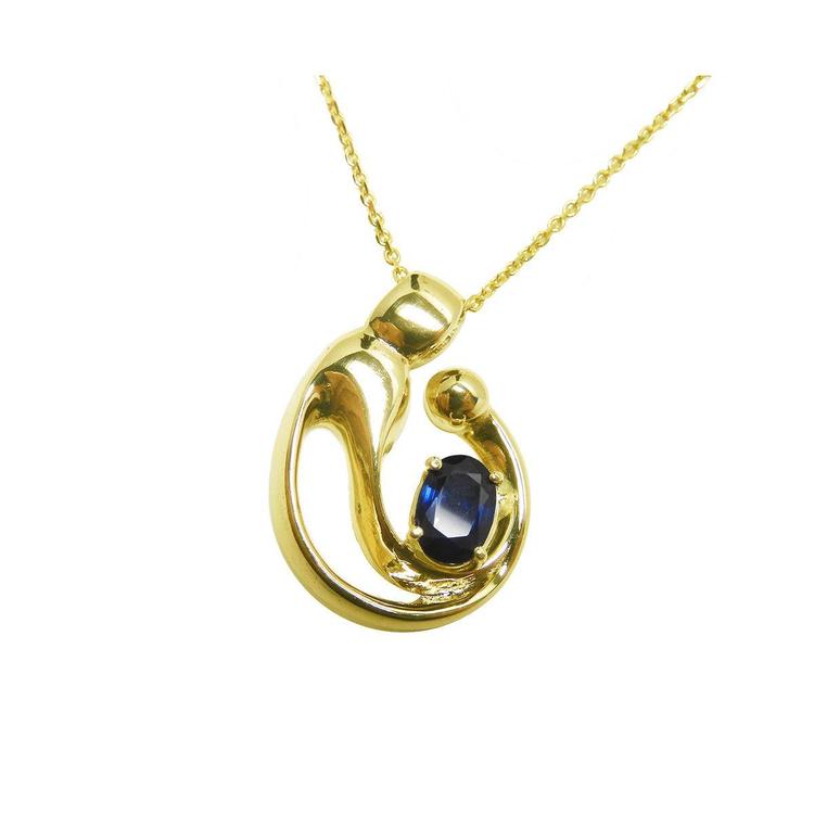 Front position top view of a mother and child sapphire necklace slider pendant crafted in 14k yellow gold
