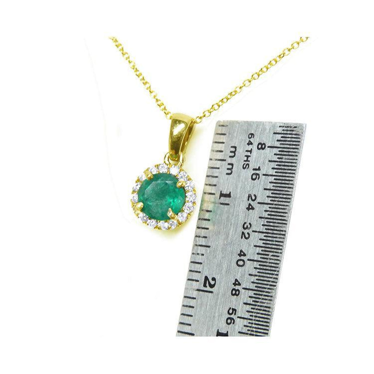 Round 0.61 ct deep green Colombian emerald halo diamond necklace in 14k yellow gold, next to a ruler.