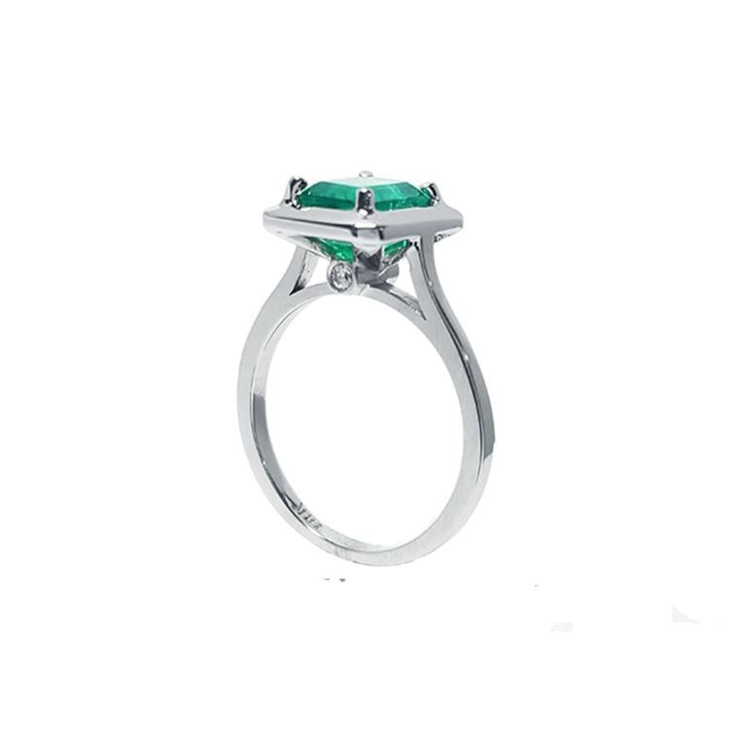 1.50 carat Muzo Colombian emerald solitaire ring in 18K white gold with a rectangular cut.