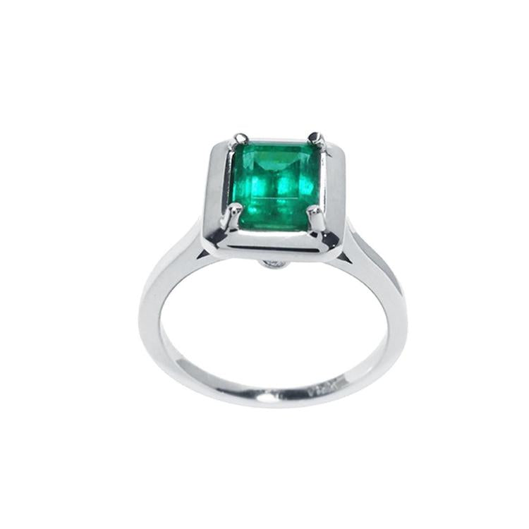 1.50 carat Muzo Colombian emerald solitaire ring in 18K white gold with a rectangular cut.