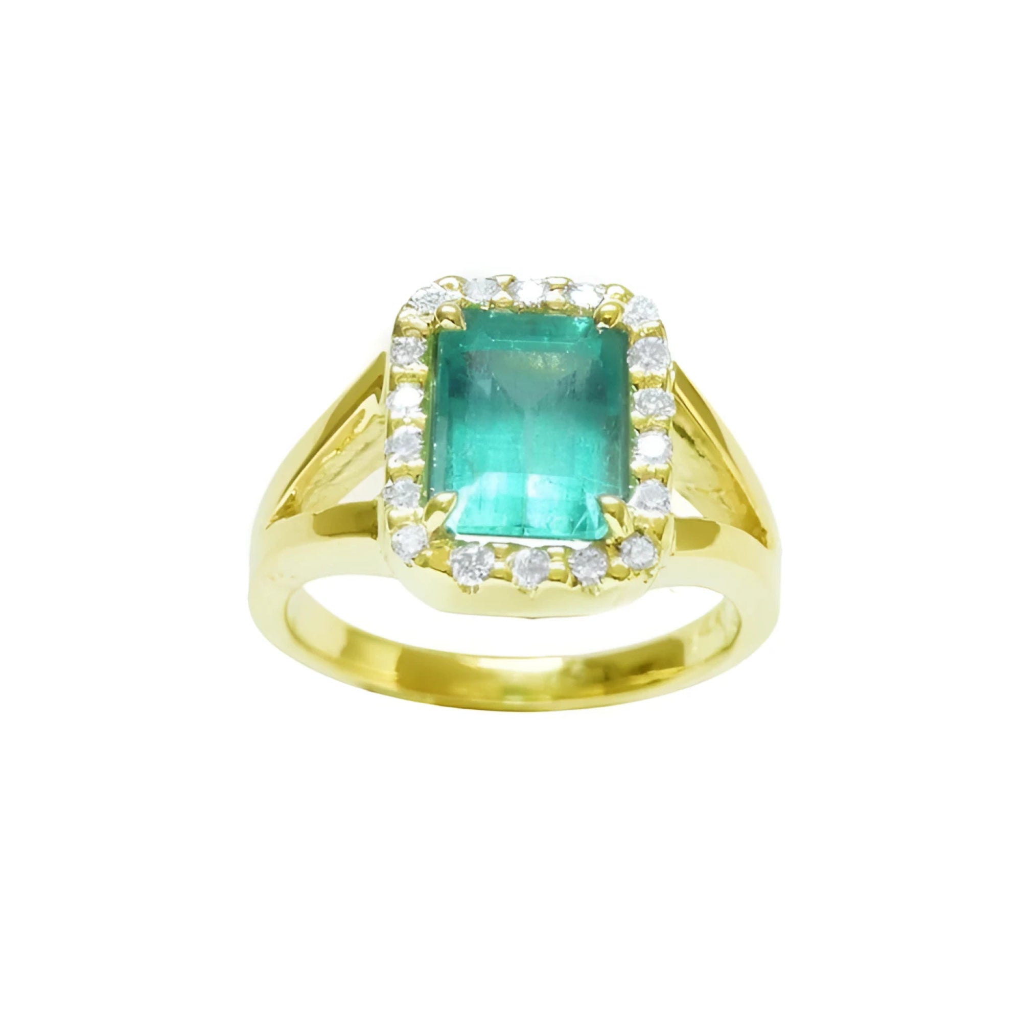 This emerald-cut Muzo Colombian emerald ring for women has a halo of natural diamonds and is crafted in 14k yellow gold.