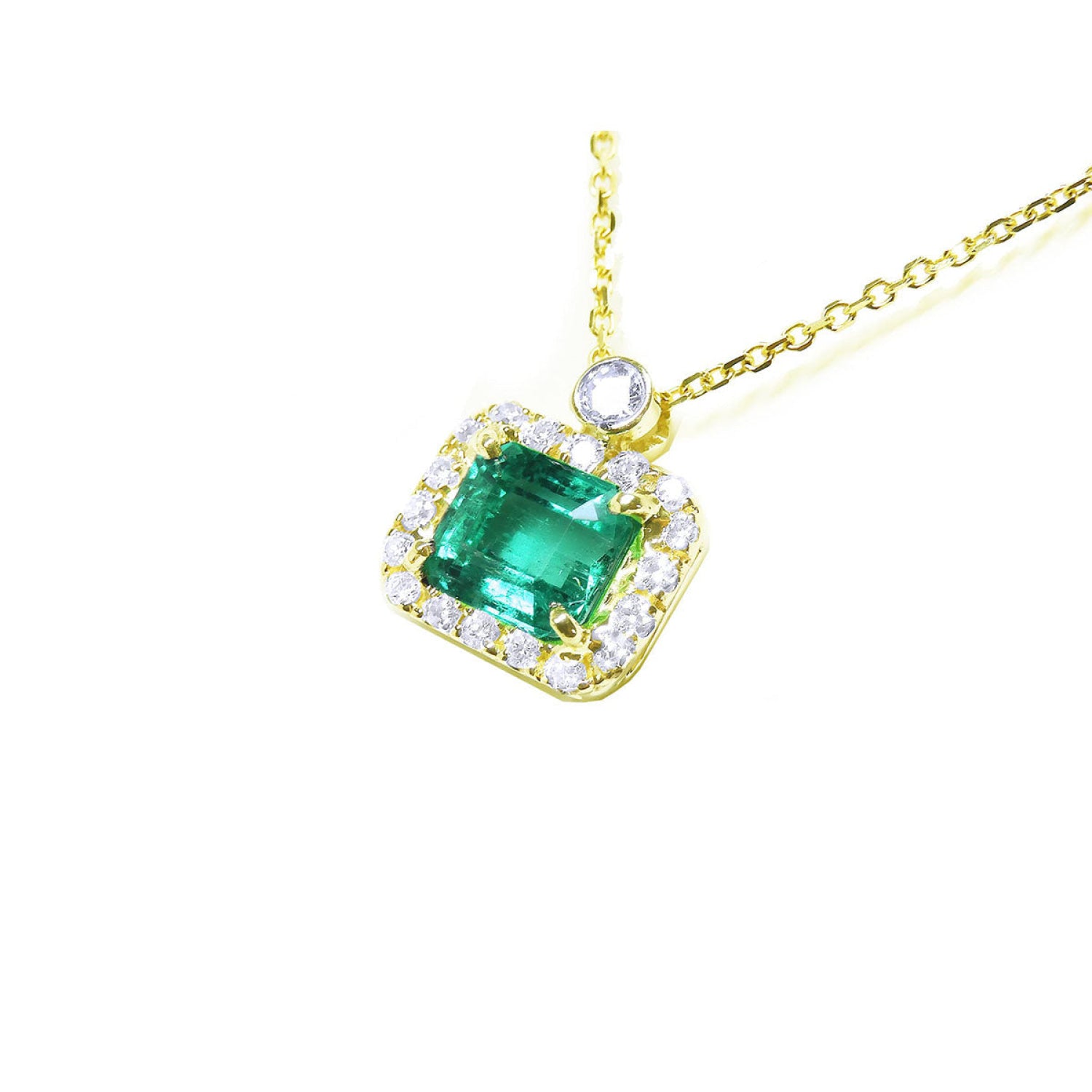 1.31 ct emerald-cut Muzo Colombian emerald necklace with diamond halo in 14K yellow gold.