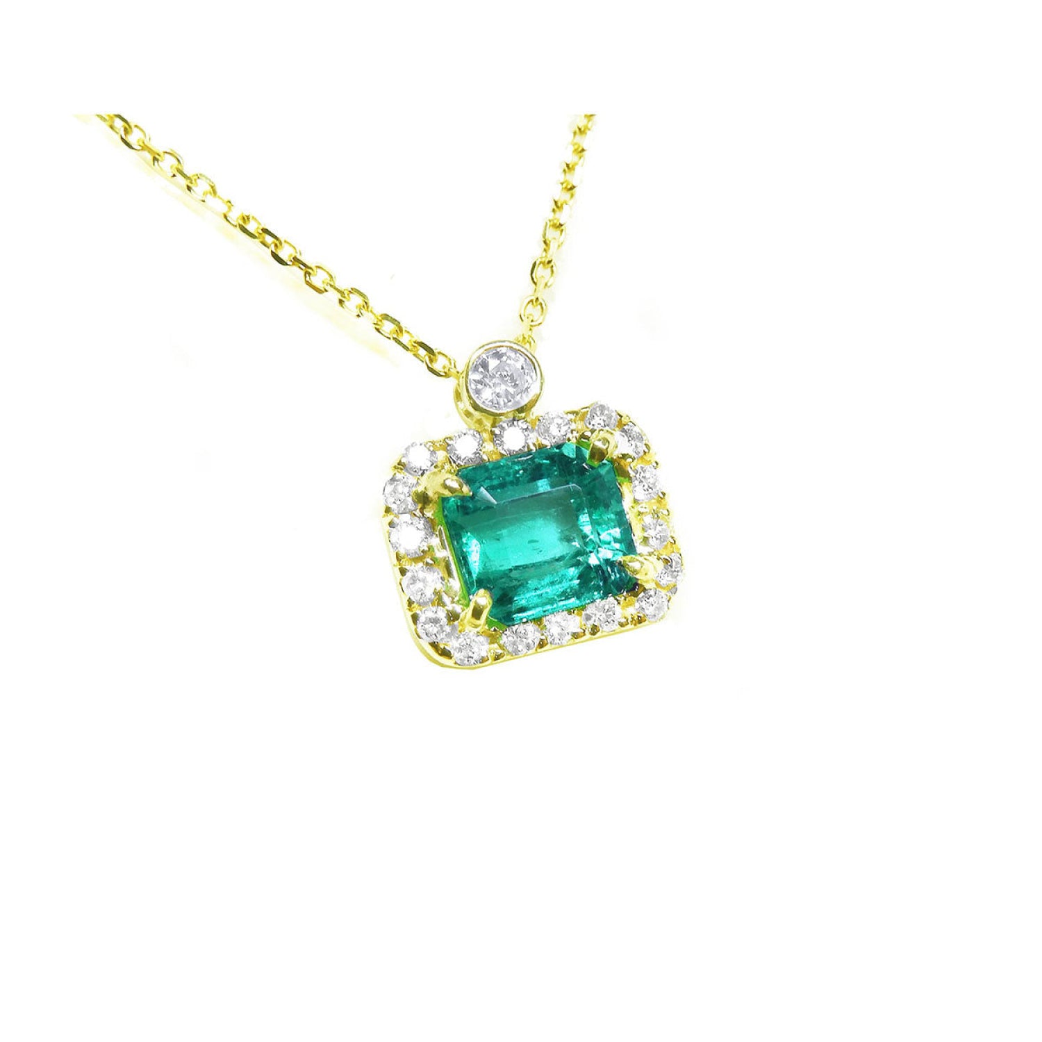 1.31 ct emerald-cut Muzo Colombian emerald necklace with diamonds in 14K yellow gold.