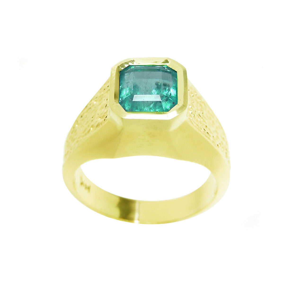 A yellow gold mens emerald solitaire ring on a white background