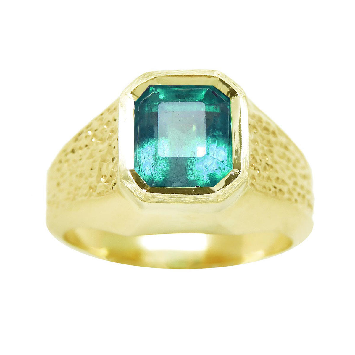 A men's solitaire ring yellow gold with a bezel set natural Muzo mine colombian emerald top and sides perspective view.