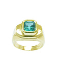 A bezel set natural colombian emerald solitaire mens emerald ring top and sides profiles view.