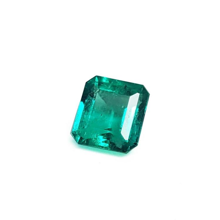 Emerald-cut Muzo mine loose Colombian emerald left side view