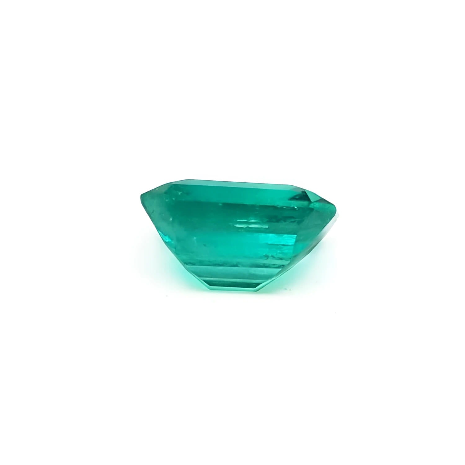 1.28 carat emerald-cut Muzo Mine loose Colombian emerald, medium deep bluish green.