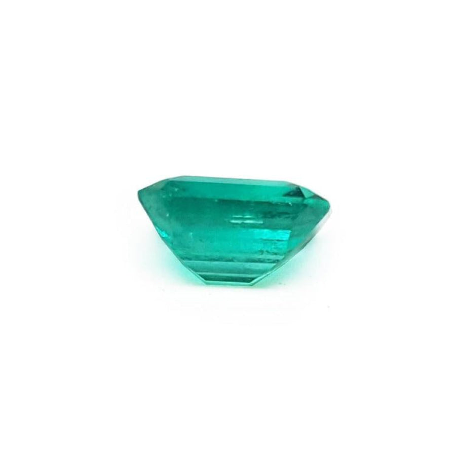 1.28 carat emerald-cut Muzo Mine loose Colombian emerald, medium deep bluish green.