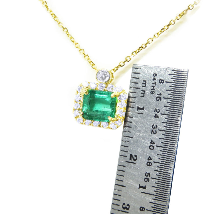 women&#39;s Necklace emerald east west orientation encircled in a halo of natural diamonds, crafted in 14k yellow gold