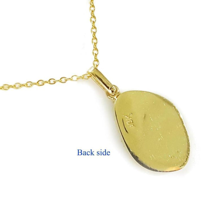 Back of 18K yellow gold pendant with oval opal, attached to a delicate gold chain.