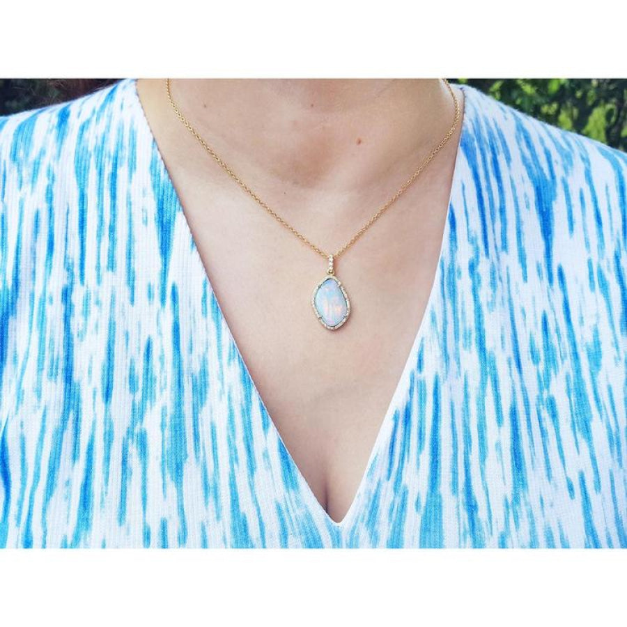 4.30 ct. natural Australian opal pendant with halo diamonds on an 18K yellow gold chain.