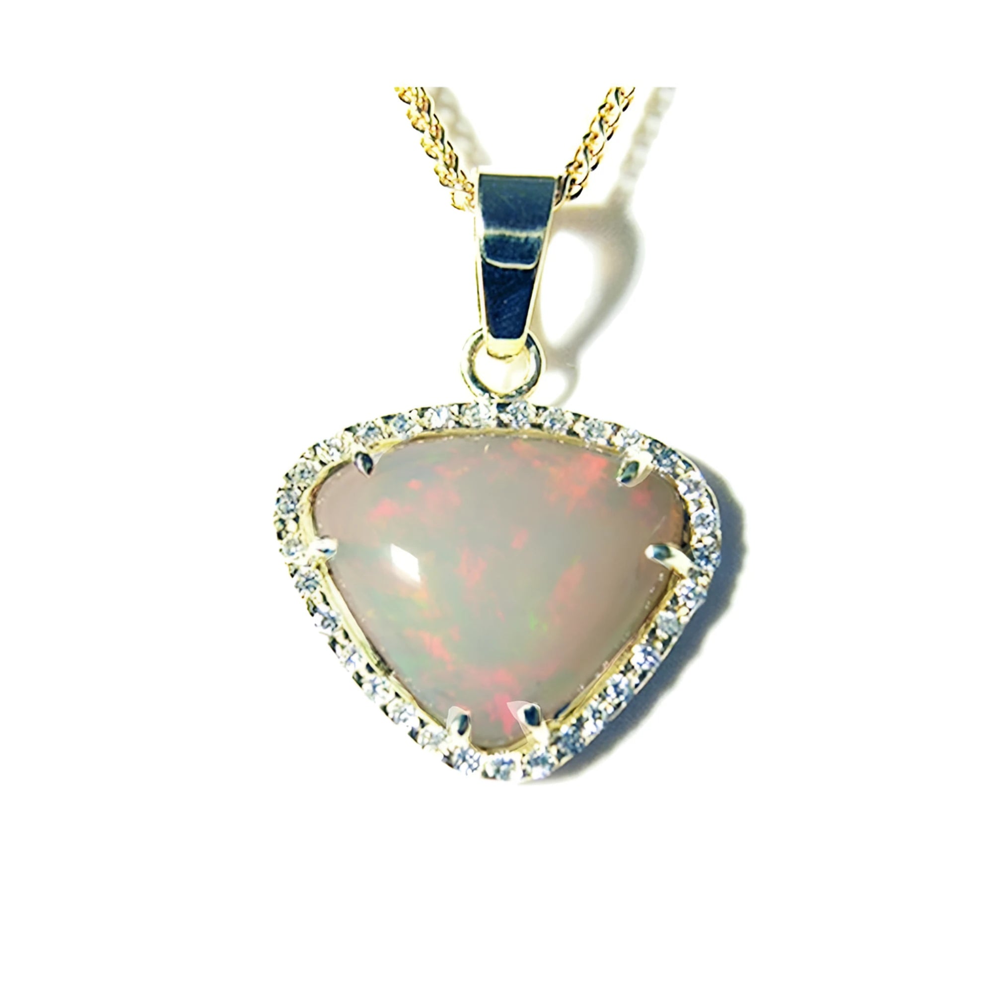 Trillion-cut Australian white opal pendant with red fire, diamond halo, and 14K yellow gold chain.