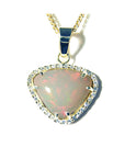 Opal pendant necklace on a topside position, displaying gold and diamonds frame.