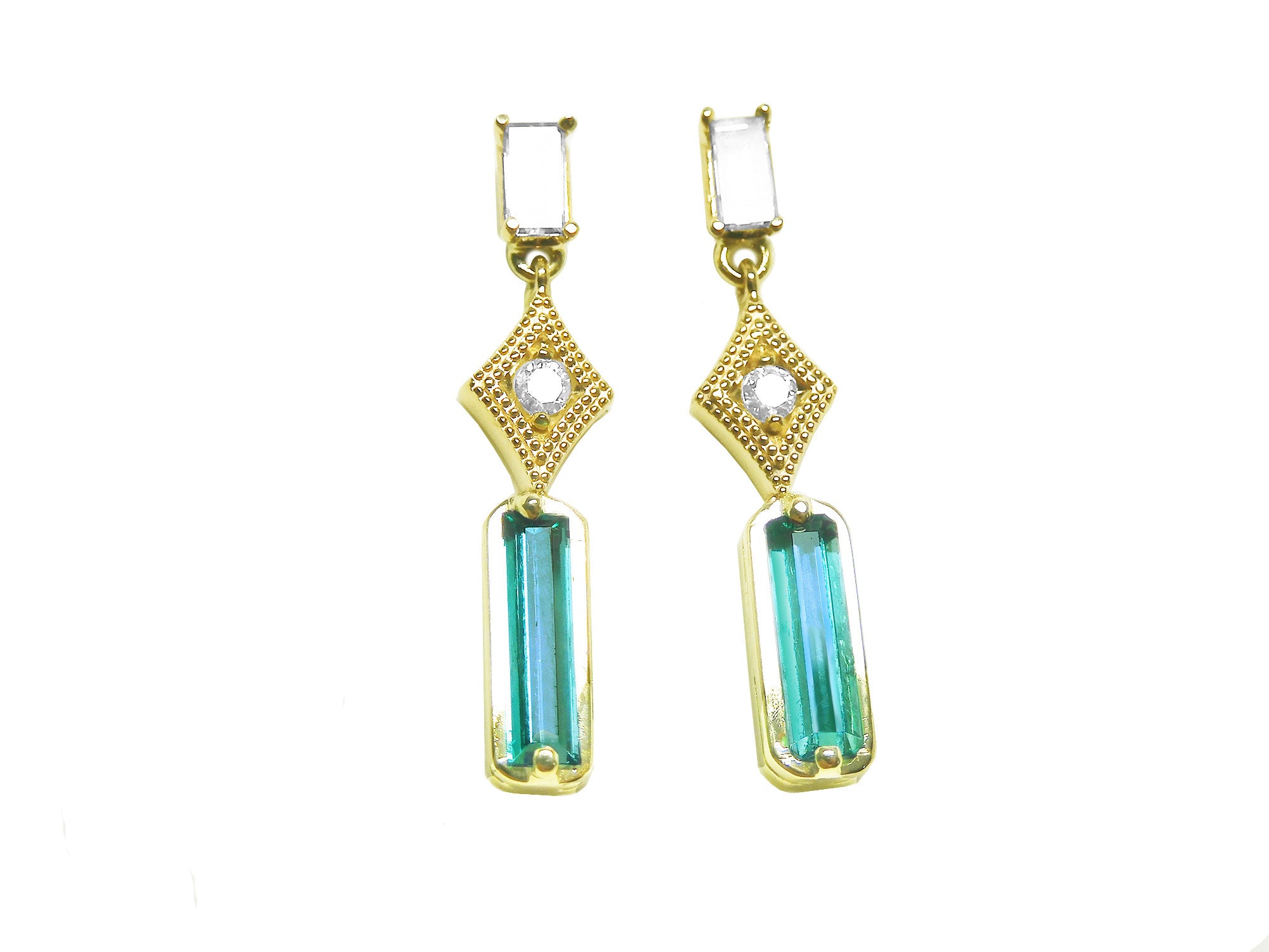 14k yellow gold earrings with baguette cut emeralds dangling from diamonds, front position top view.
