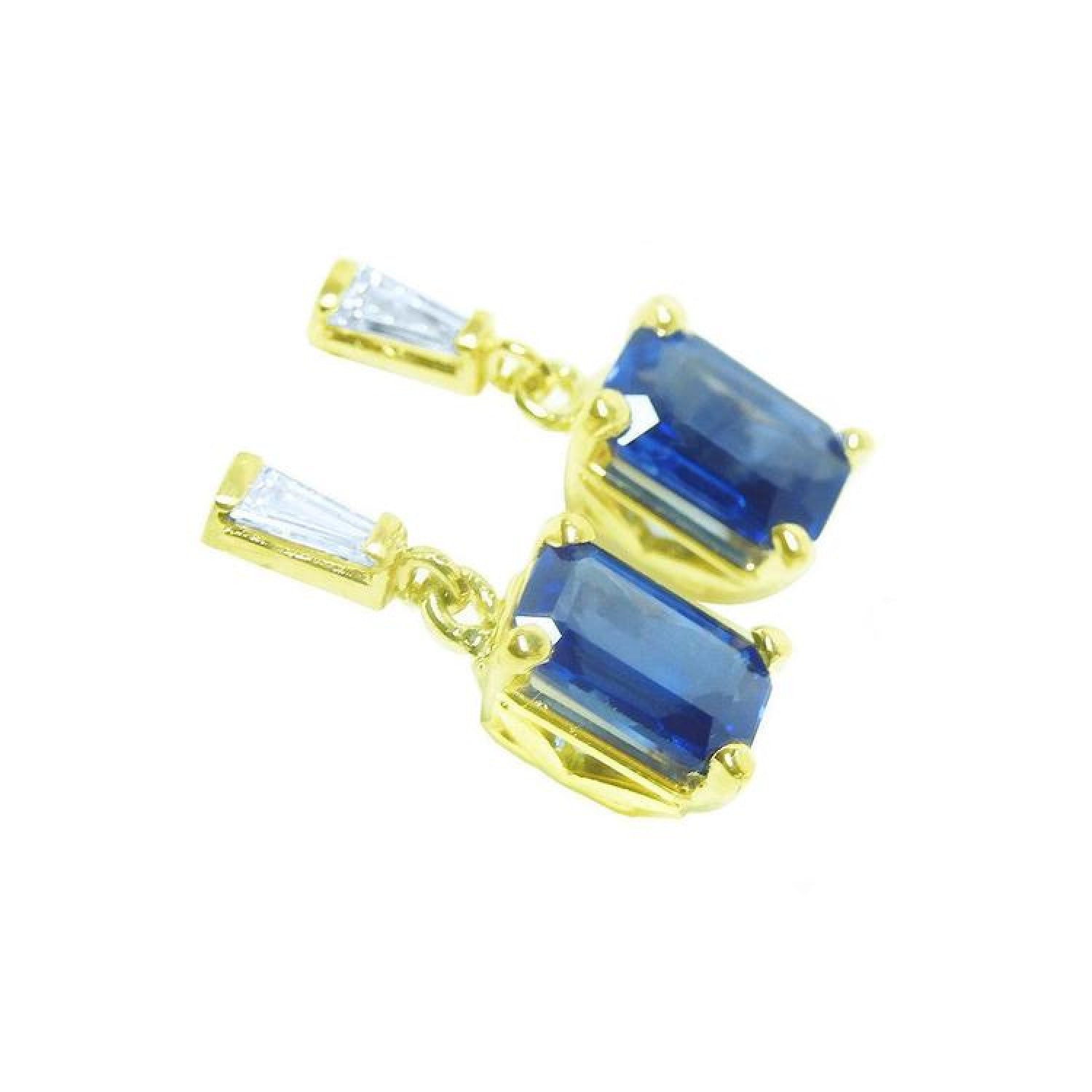 14K yellow gold blue sapphire emerald cut dangle earrings with tapered baguette diamonds.