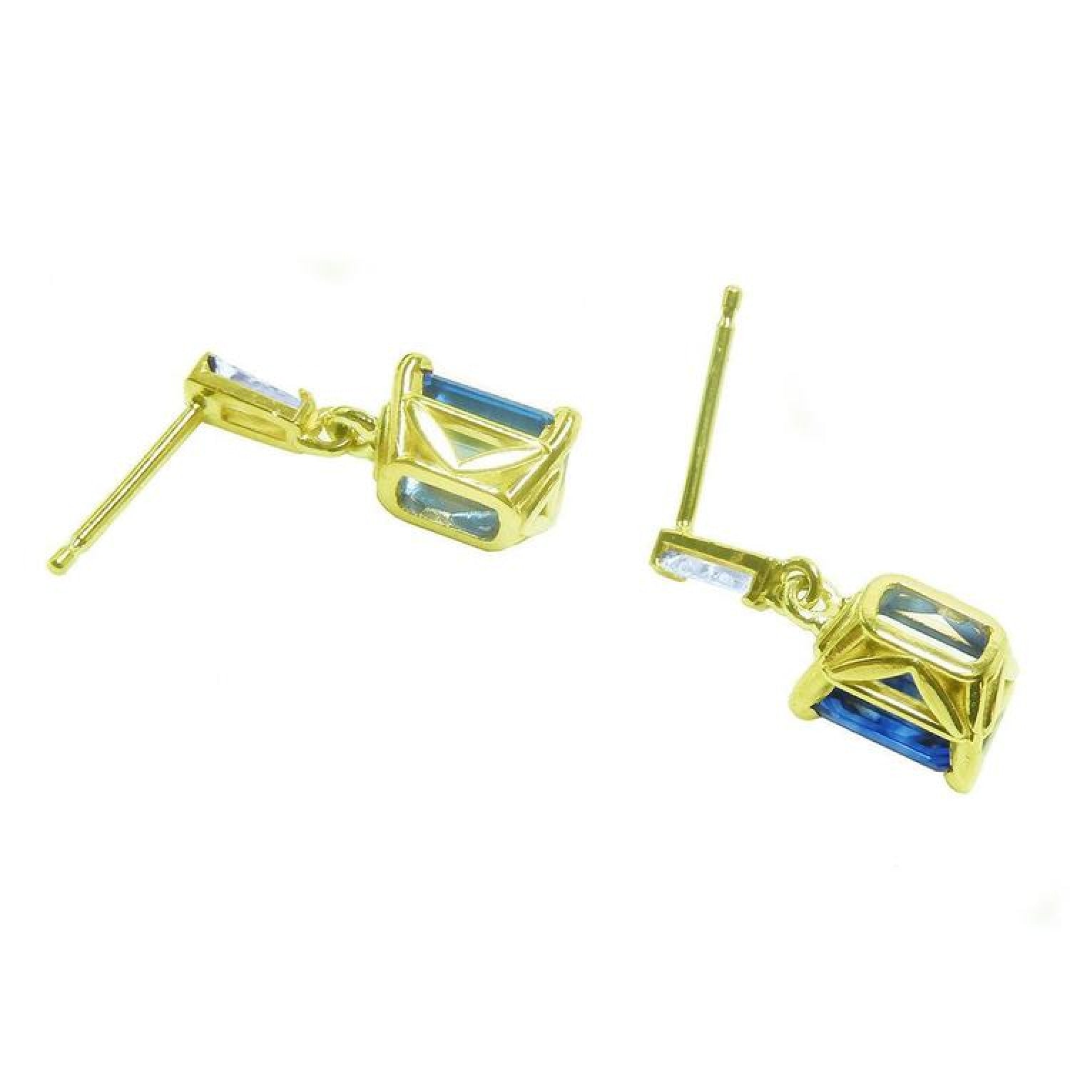 14K yellow gold blue sapphire emerald cut dangle earrings with tapered baguette diamonds.
