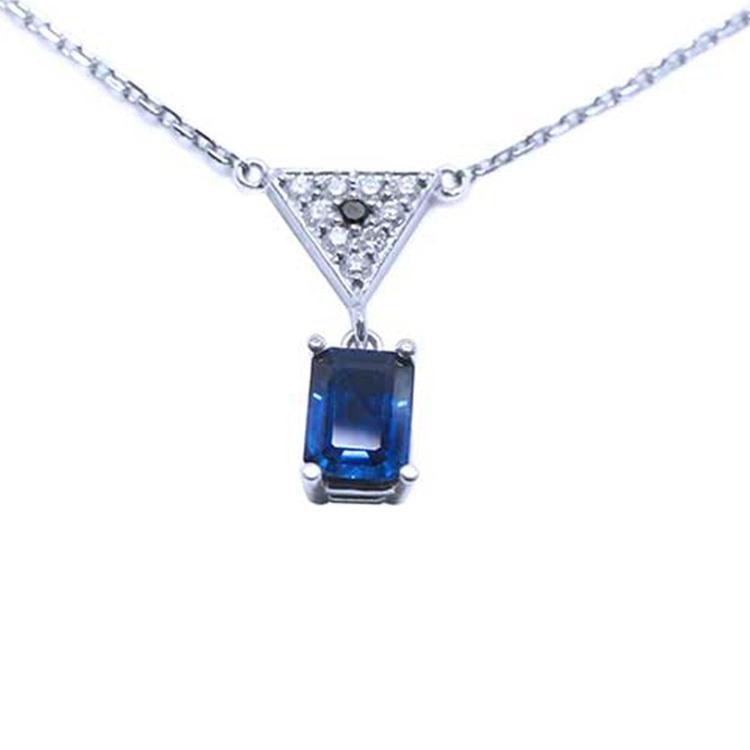 1.05 carat natural blue sapphire necklace in 14K white gold with a trillion diamond centerpiece.