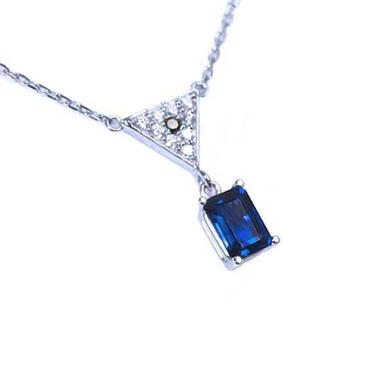 Right side top view of a natural blue sapphire necklace with diamonds 14k white gold dangling pendant