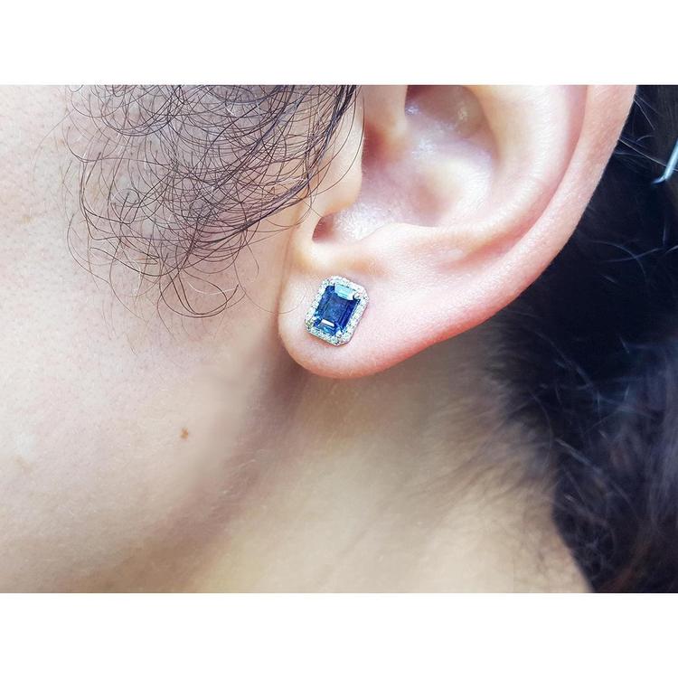 Natural blue sapphire stud earrings emerald cut halo diamond 14k white gold, lifestyle view