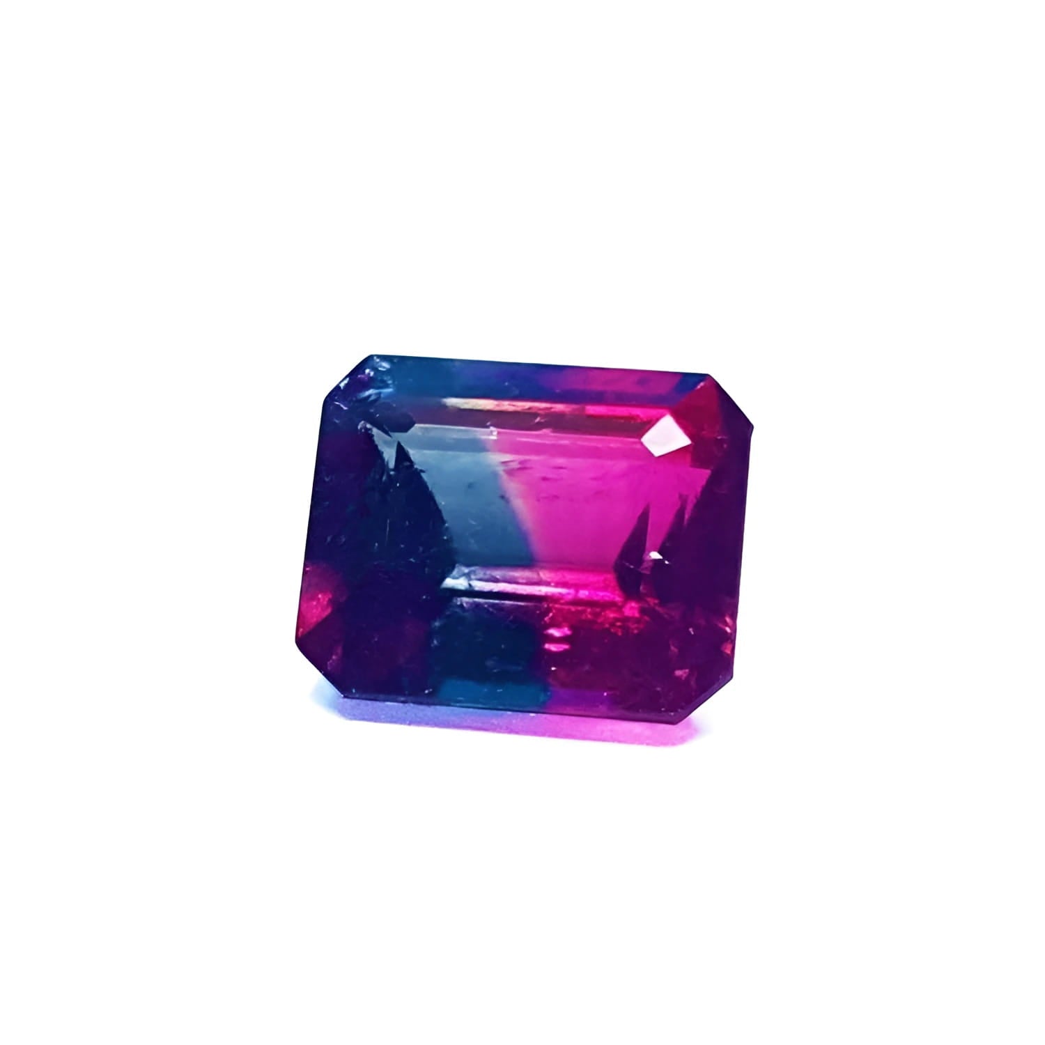 Natural 3.55 ct. emerald-cut watermelon tourmaline with vibrant red, mint, and greenish-blue hues.