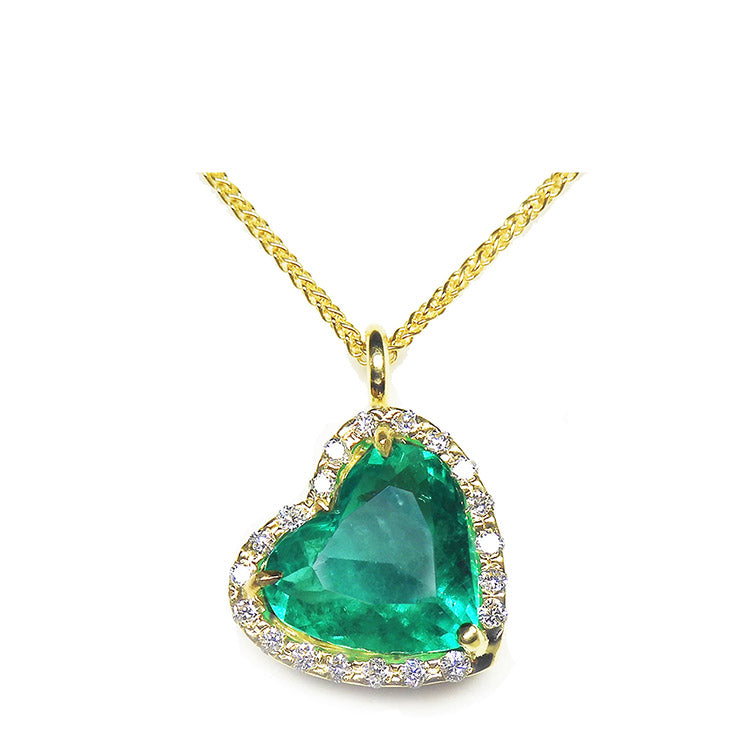 A gorgeous selection of 18k and 14k gold pendants showcasing natural Colombian emeralds, adorned with genuine diamonds and crafted into truly exquisite fine emerald jewelry.