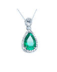 5.83 ct. Colombian emerald pear cut pendant with diamond halo in 18K white gold.