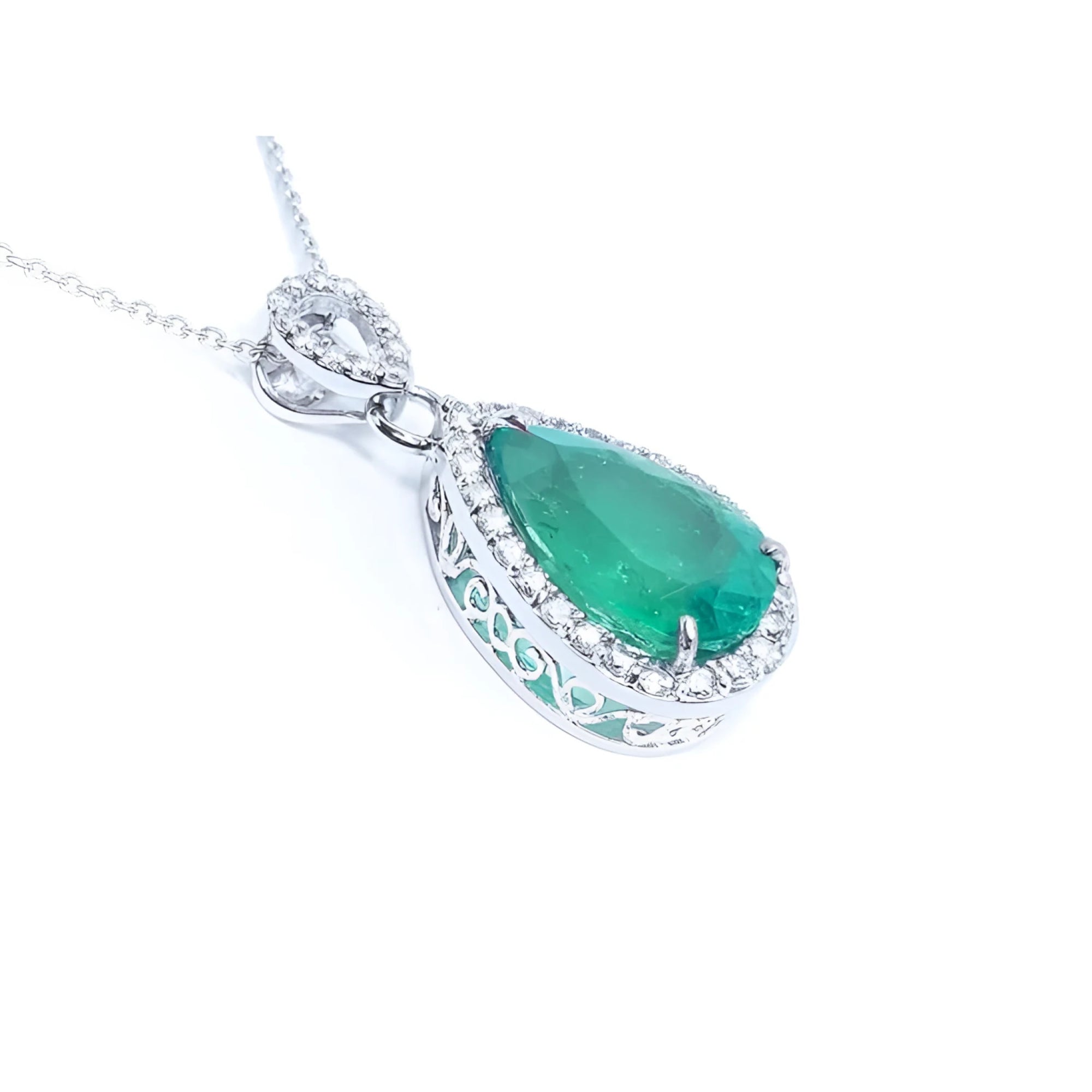 Emerald green teardrop pendant with white gold chain on a right side position topside and gallery visibles.