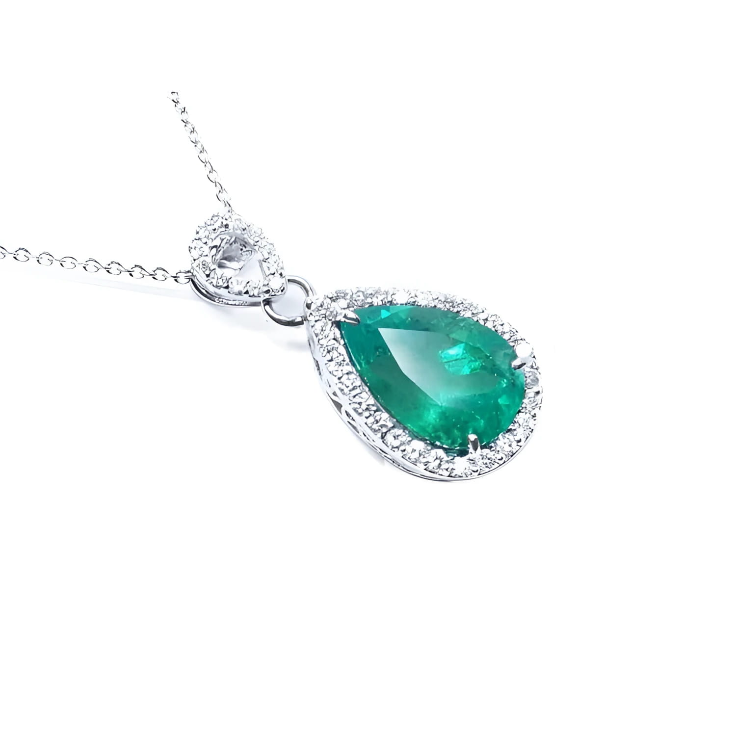 Pear-cut Colombian emerald pendant with diamond halo, set in 18K white gold.