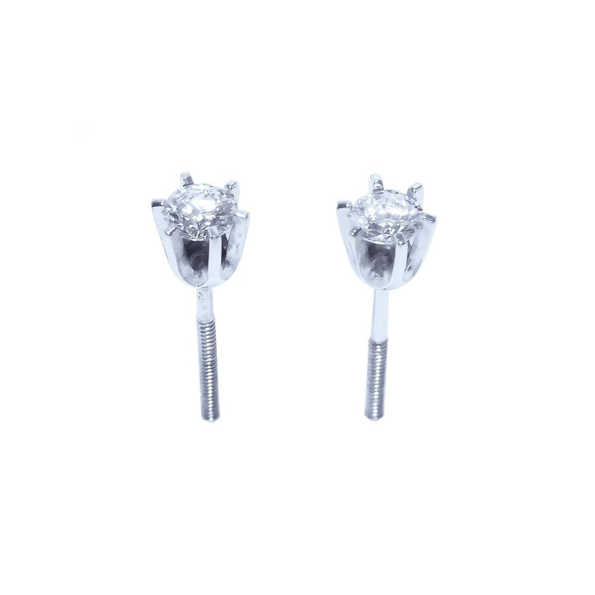 Top and underside view of a 14k white gold diamond stud earrings screw backs.