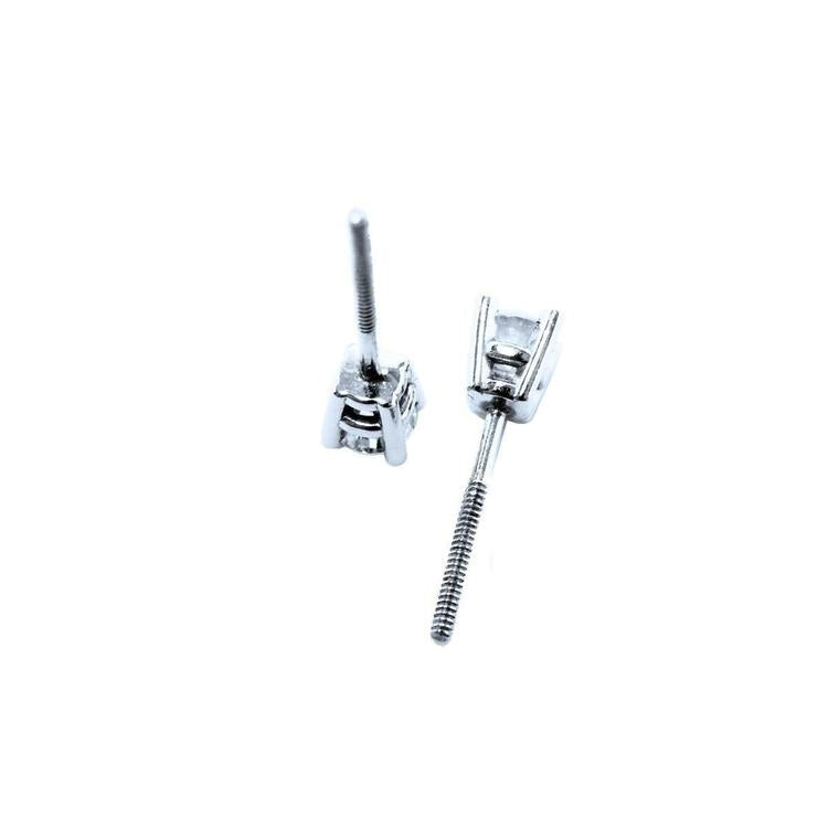 A pair of screw backs natural diamond stud earrings white gold.