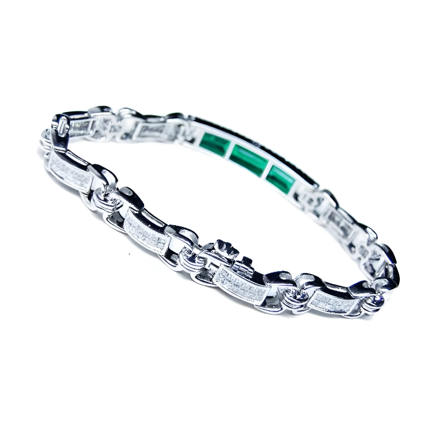 Silver bracelet with vibrant Colombian emeralds and princess cut diamonds.