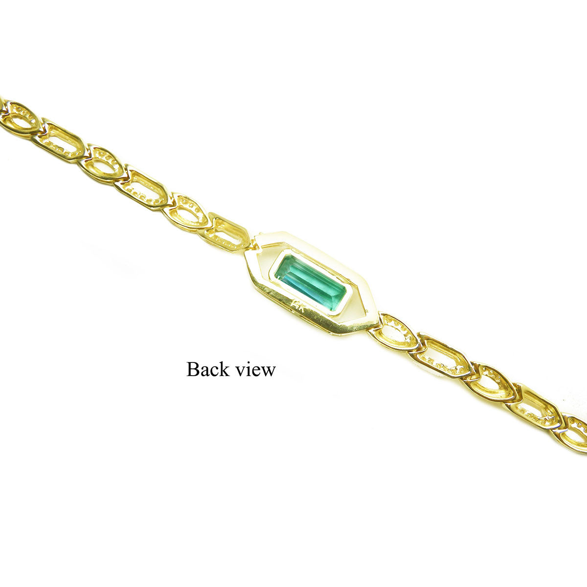 The back side view of a gold bracelet with a rectangular emerald on a white background