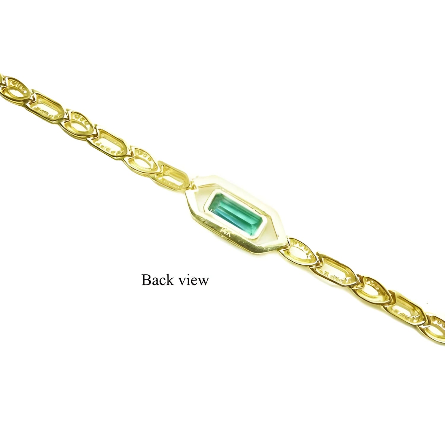 Back view of a 14K yellow gold bracelet with a rectangular emerald-cut green emerald.
