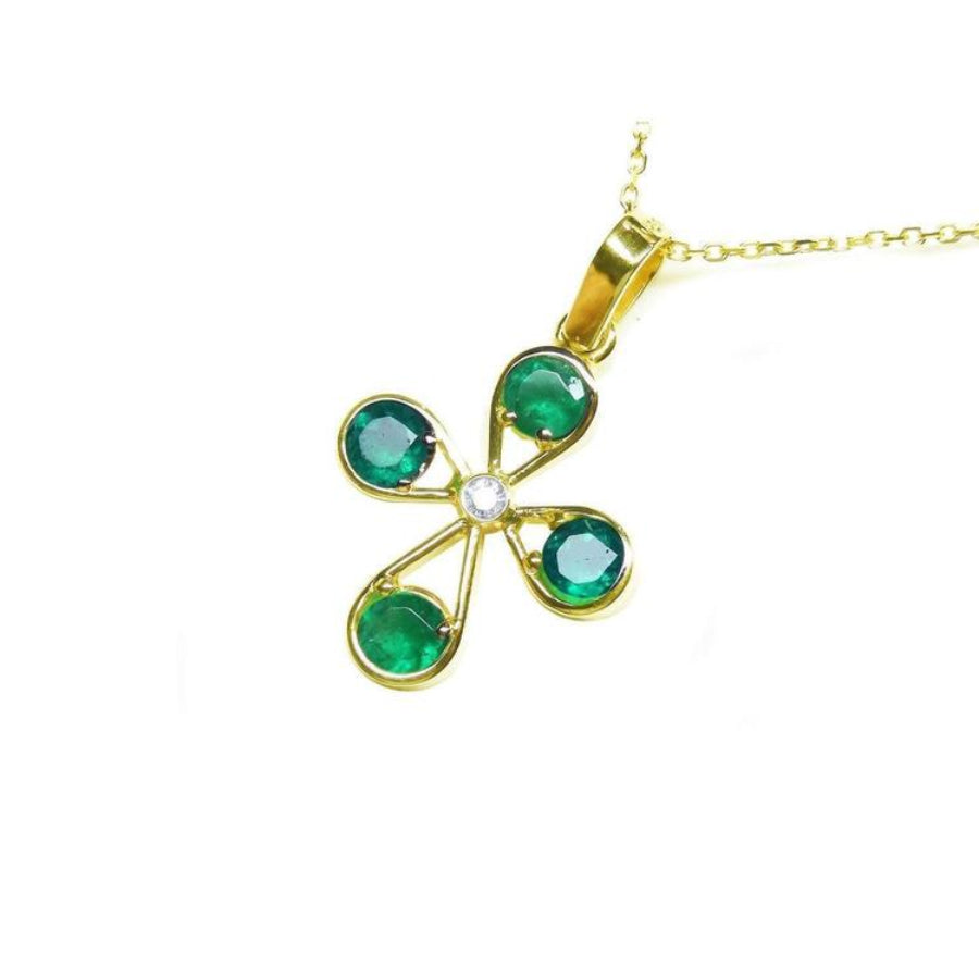18K yellow gold cross pendant with four round Colombian emeralds and a central diamond.