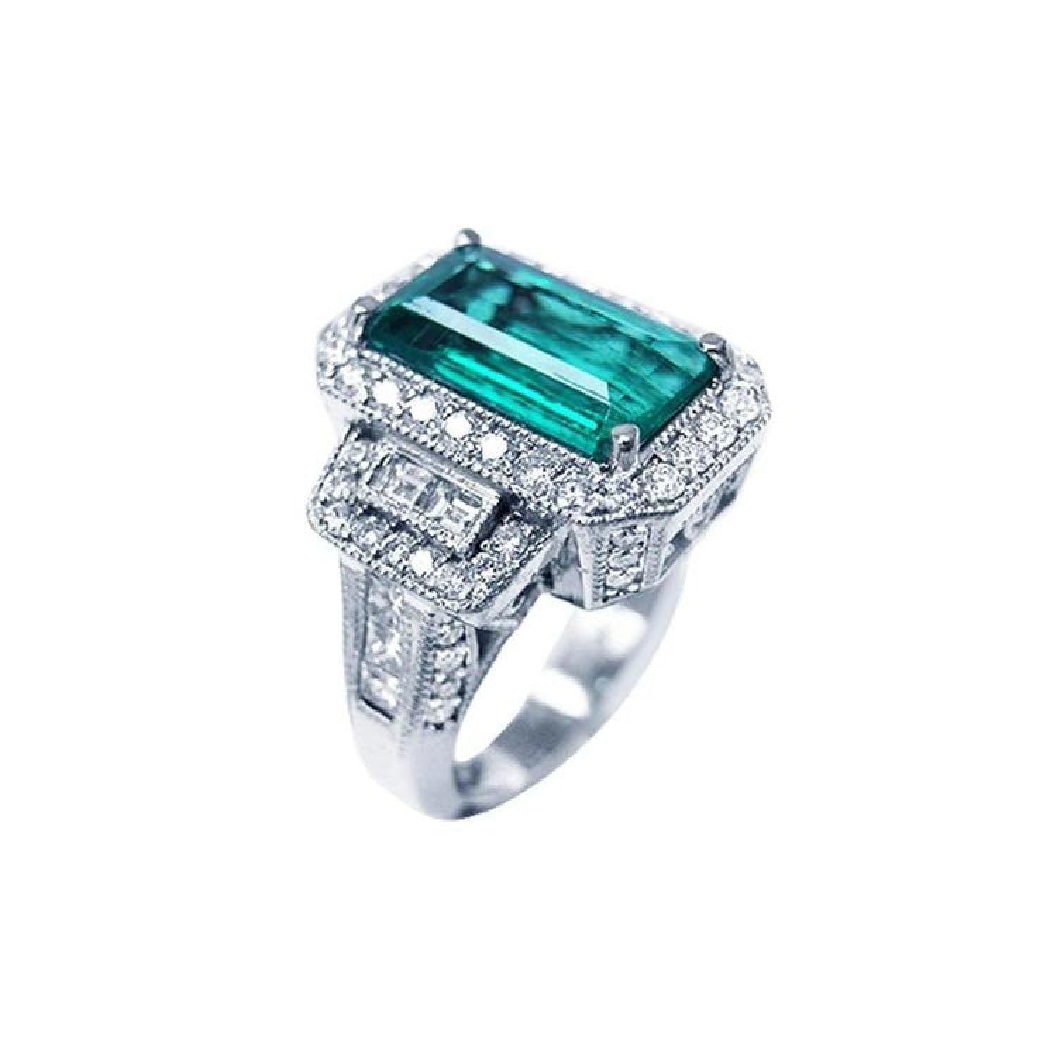 18K white gold ring with a rectangular F1 Colombian emerald, haloed by diamonds, and baguette side stones.