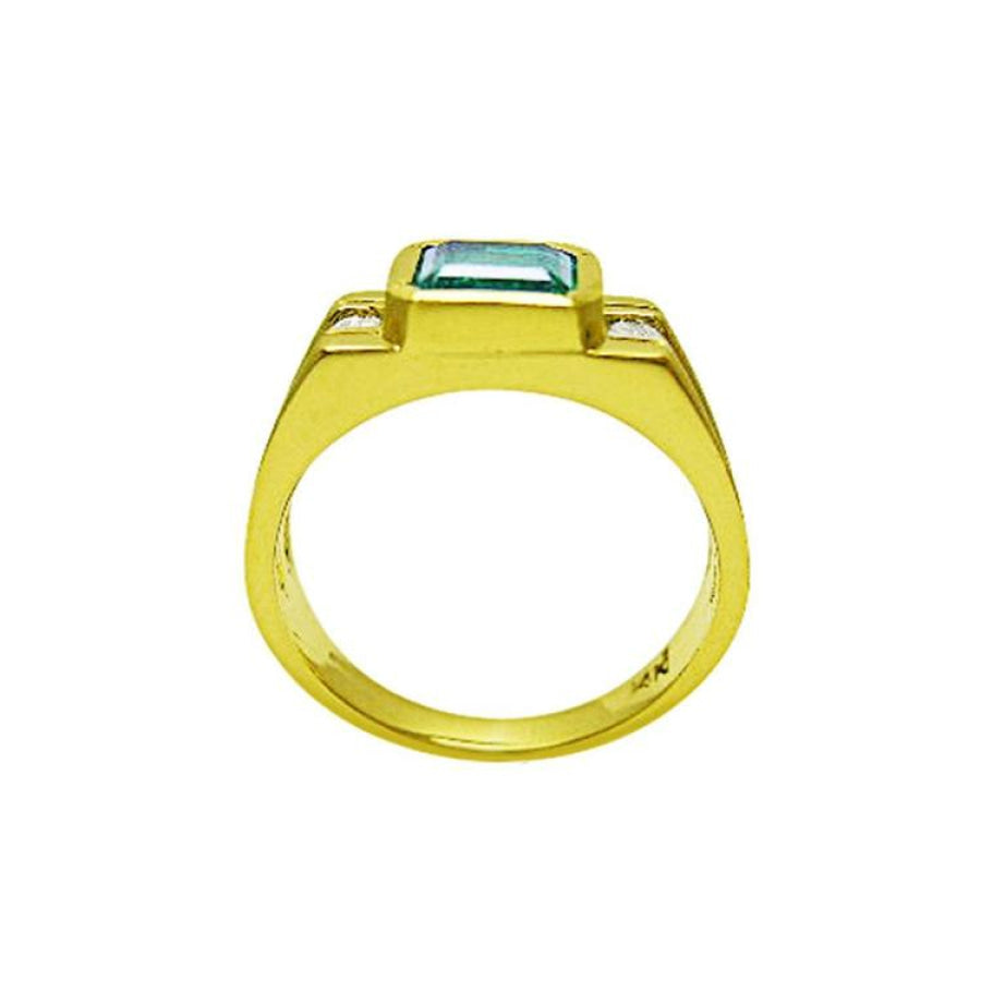 Men's 14K yellow gold ring with a bezel-set natural emerald and side diamond accents.