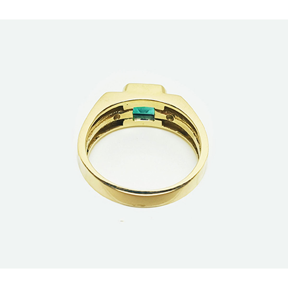 The underside view of this men&#39;s natural emerald ring in yellow gold.