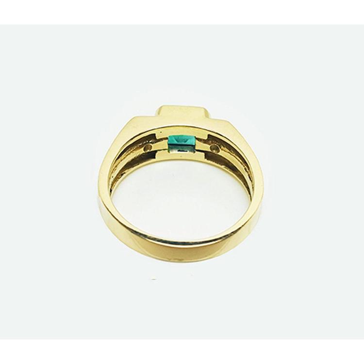 The underside view of this men's natural emerald ring in yellow gold.