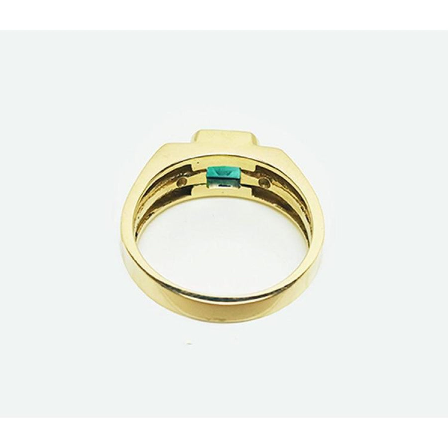 Men's 14K yellow gold ring with a bezel-set natural emerald and side diamonds.