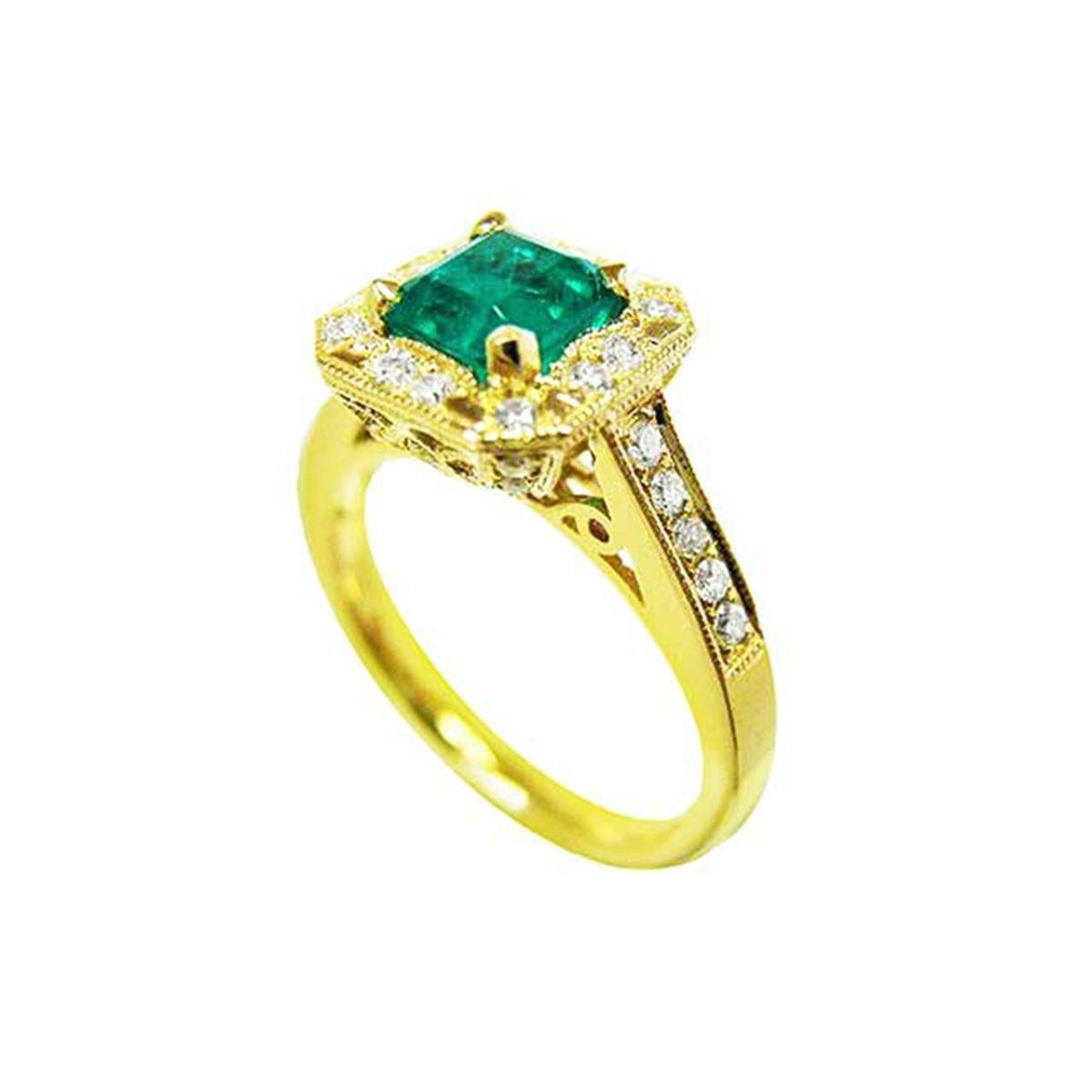 Gold ring with a natural emerald and diamond accents on a white background.