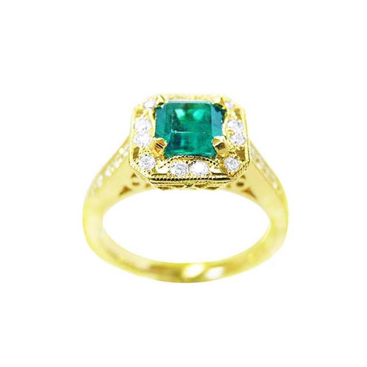 Top side view of a 14k yellow gold emerald and diamond ring.