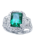 This natural emerald engagement ring is displaying the top-down profile view.