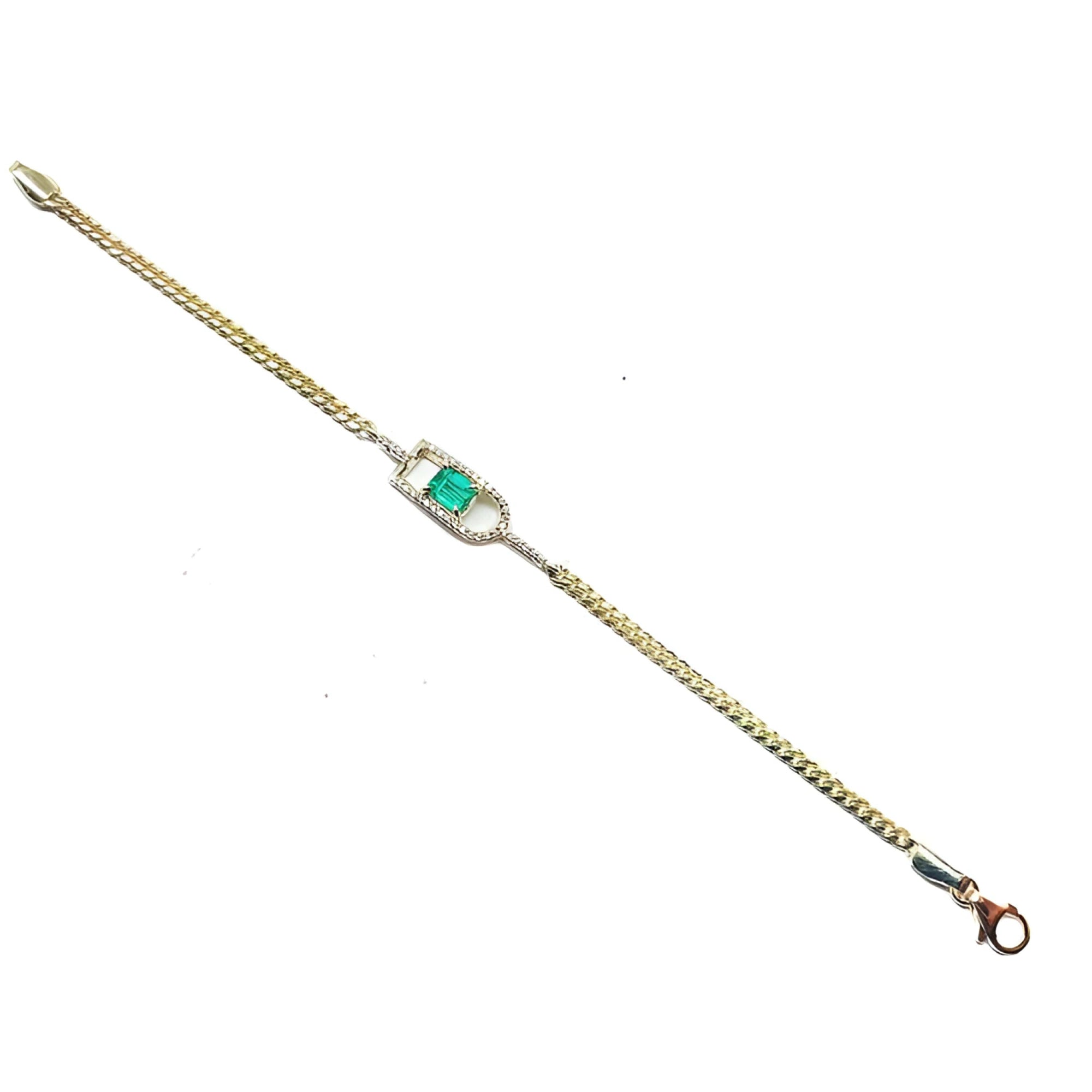 14K yellow gold bracelet with a square emerald-cut Colombian emerald in a diamond-accented setting.