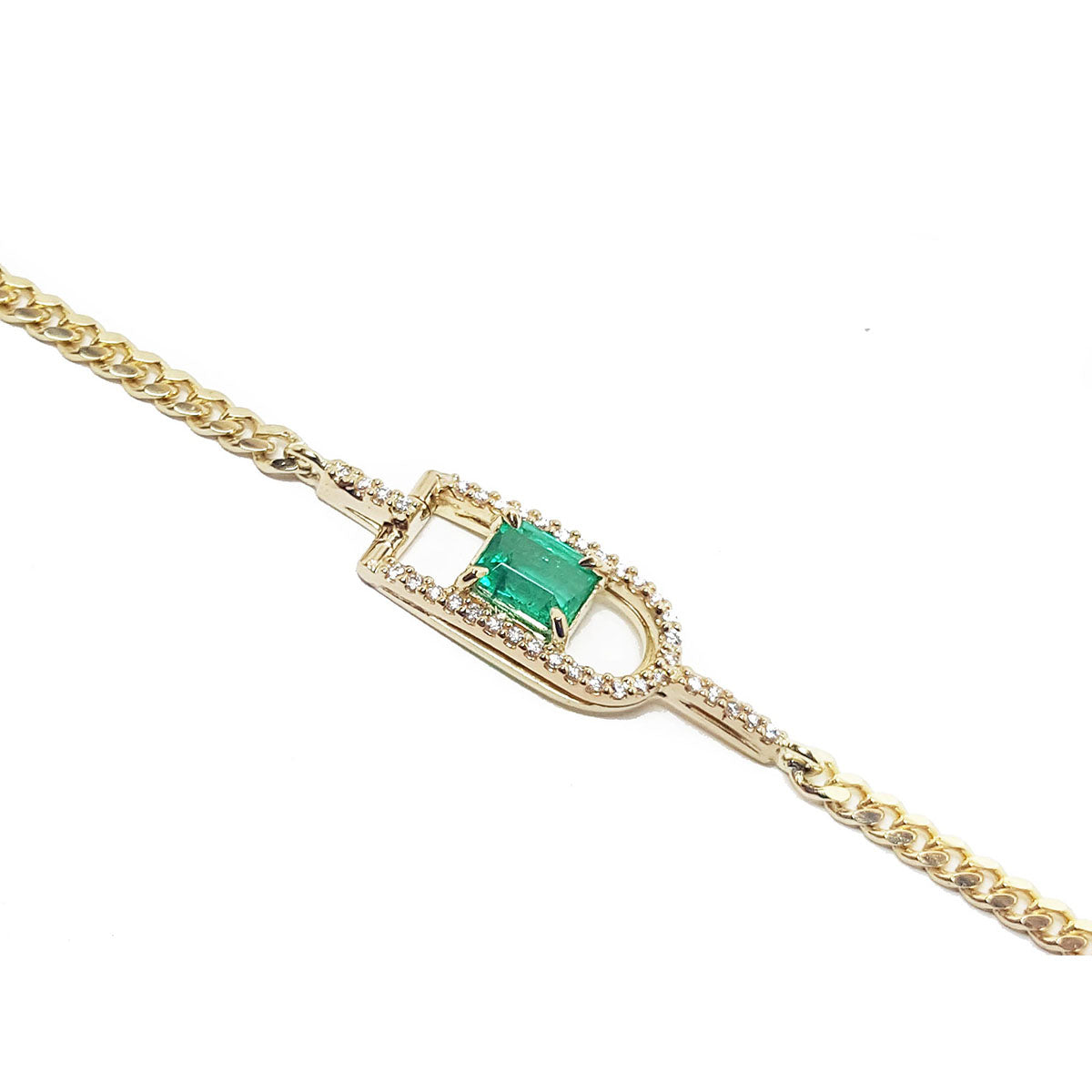 Gold bracelet with a square natural emerald on a side profile view.