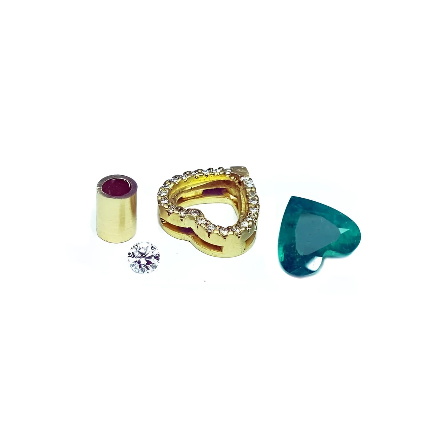 Components for a heart pendant: gold setting with diamonds, loose diamond, emerald, and gold bail.