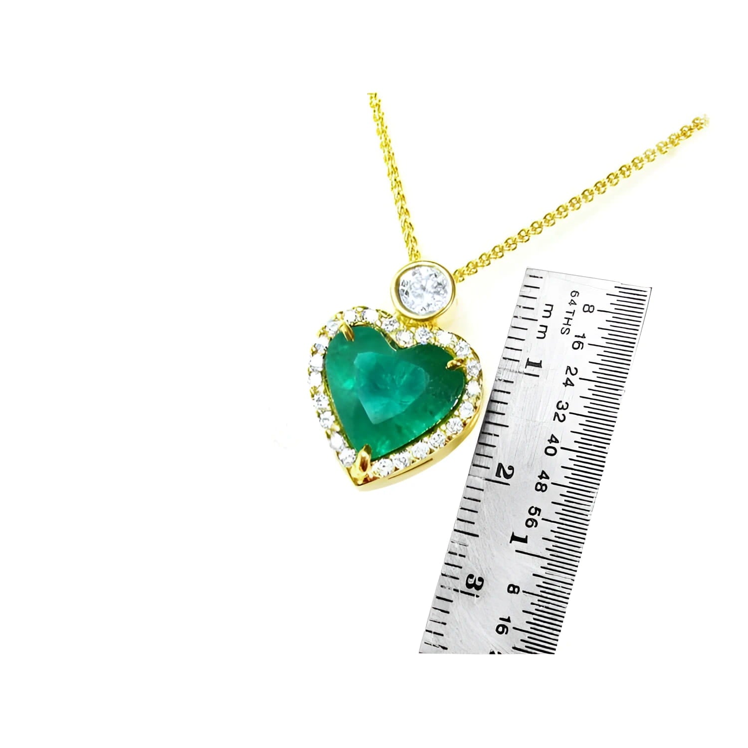 18k gold heart pendant with a large bluish-green emerald, halo diamonds, and a delicate gold chain.
