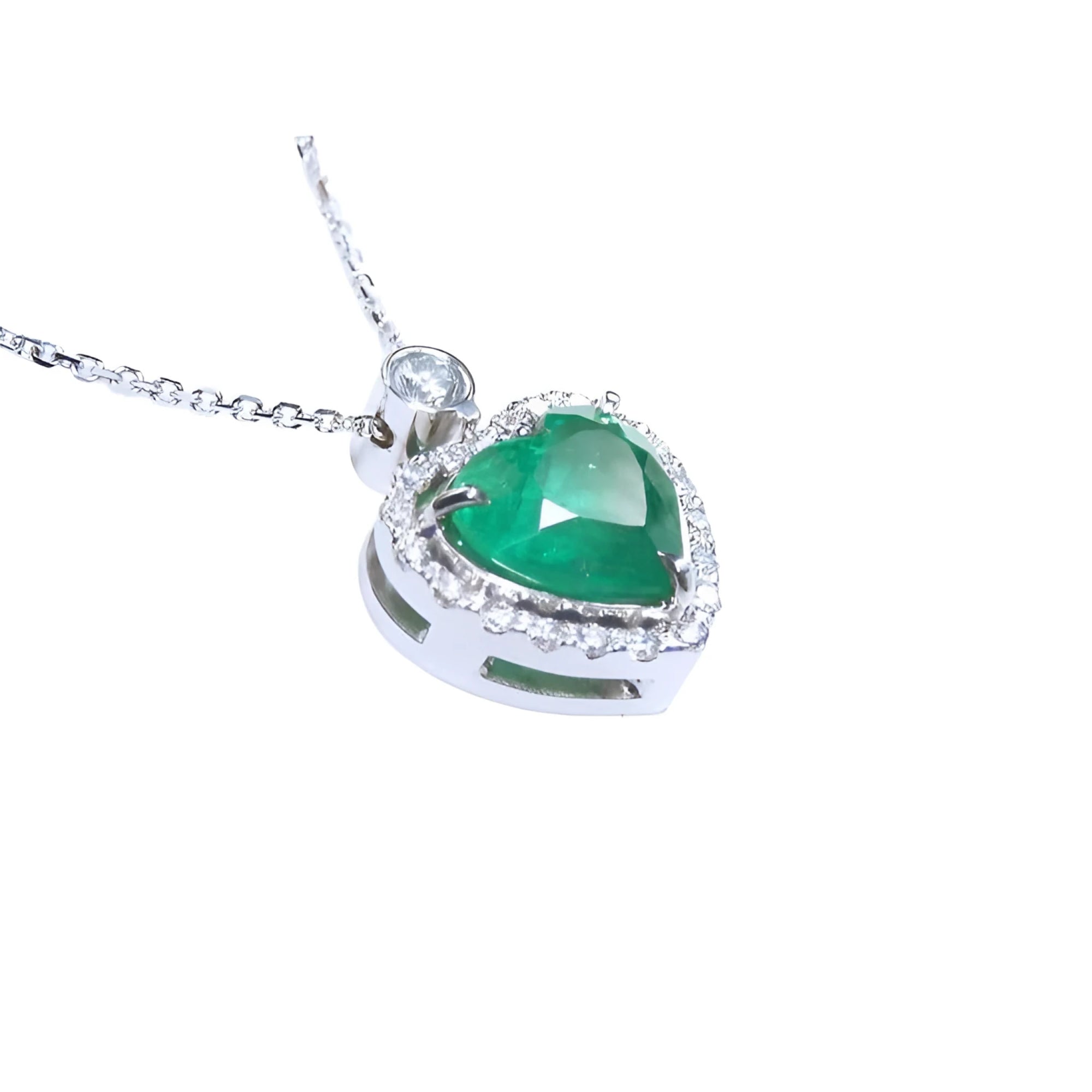 2.64 ct natural emerald heart pendant in 14K white gold, framed by diamonds on a delicate chain.