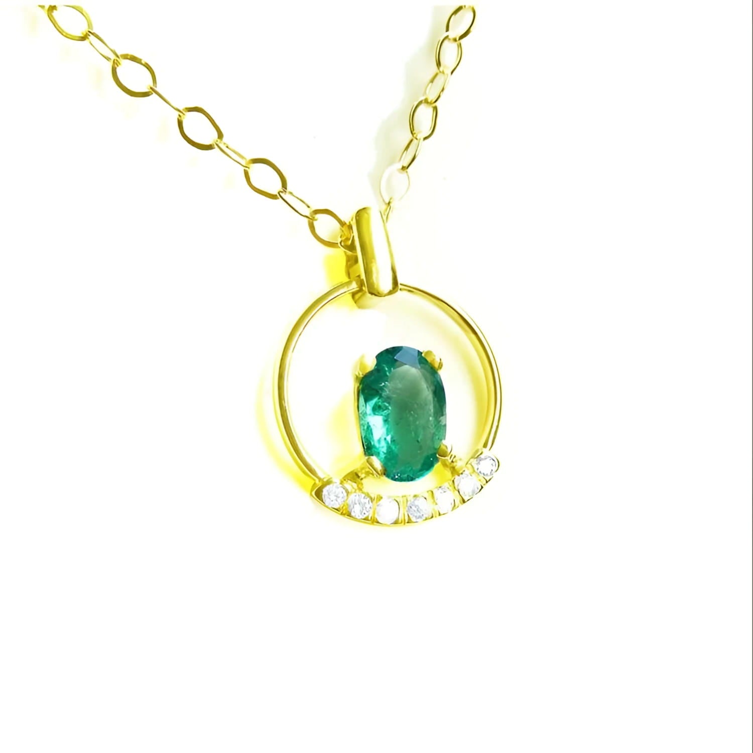 Oval cut natural colombian emerald in 14k yellow gold necklace with diamonds.
