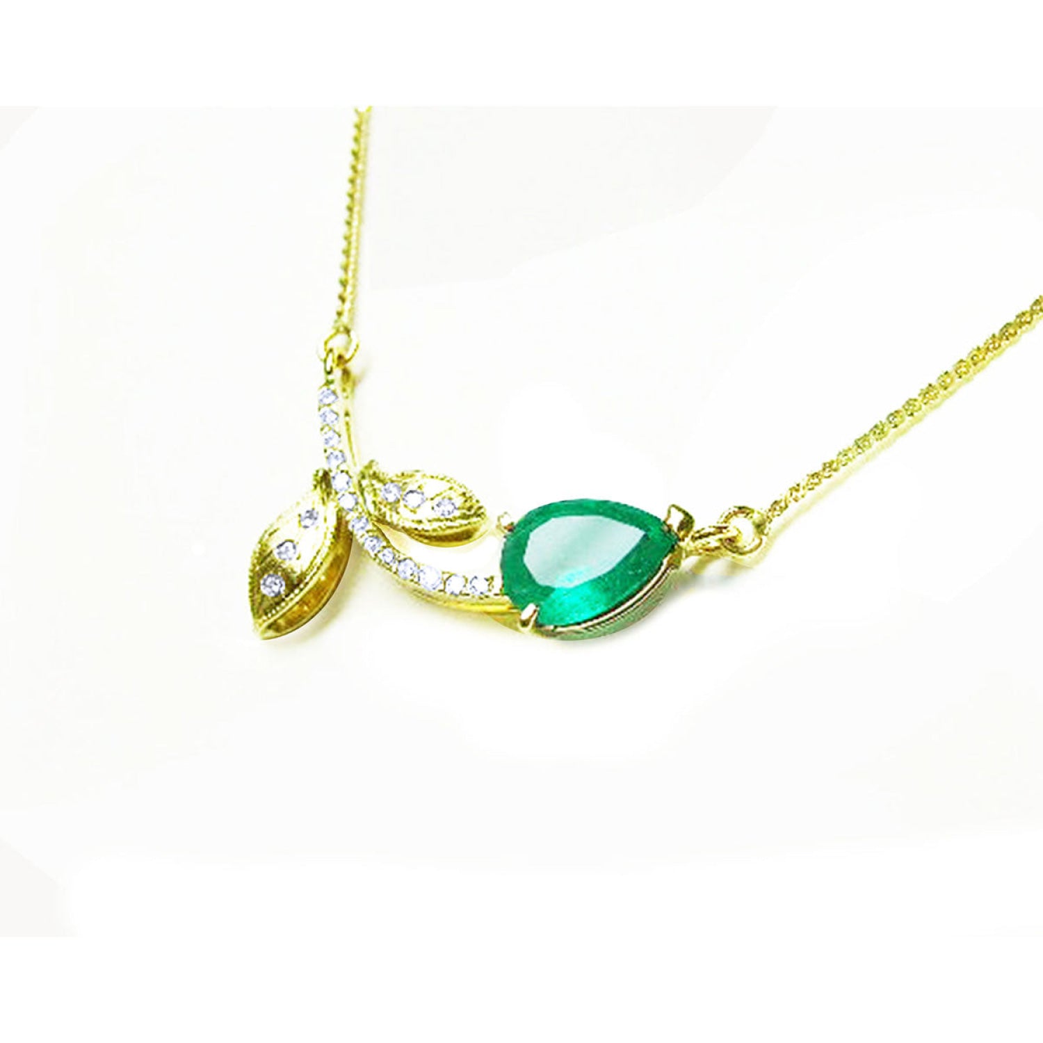 1.66 carat pear-cut natural emerald necklace in 14K yellow gold with diamond accents and leaf design.